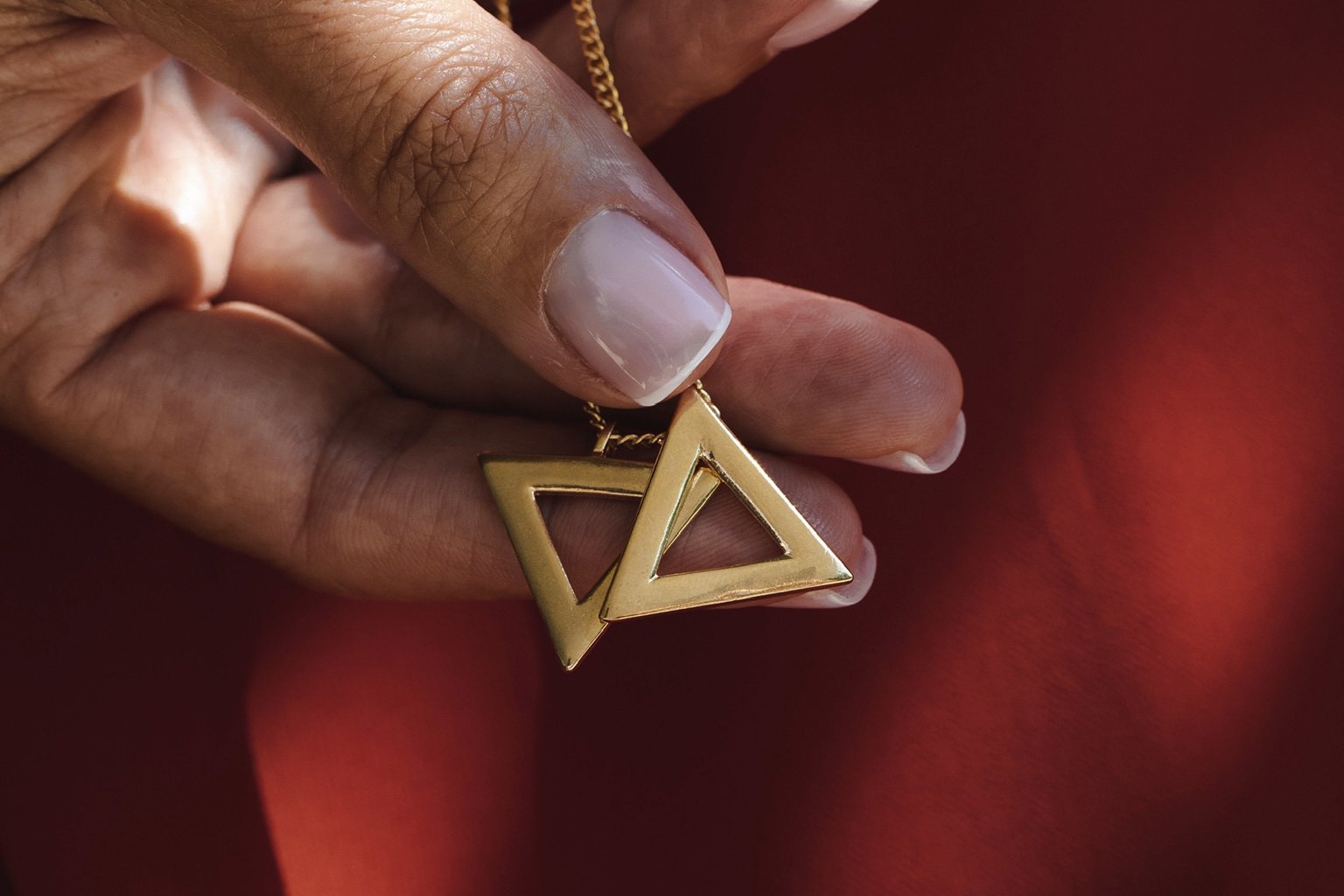 Two Become One — the two interlocking triangles in hand