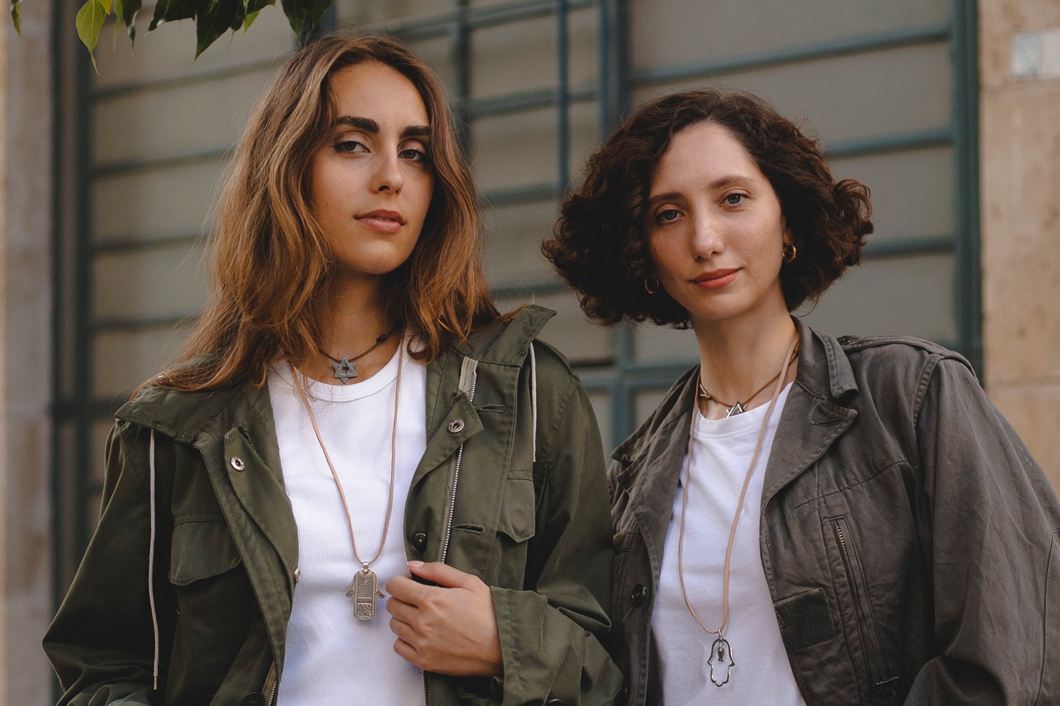 Two women in the street, the pieces worn as their own