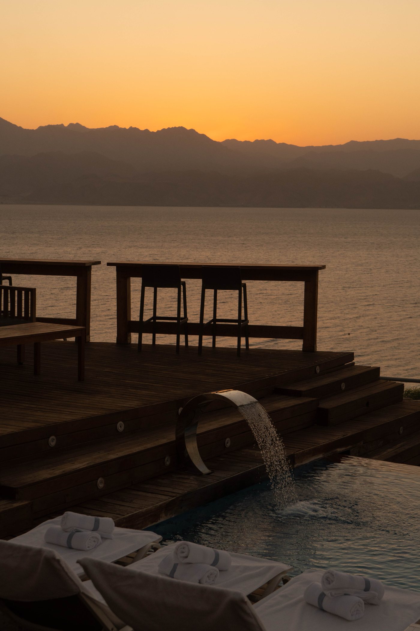 The jetty and its loungers as the light drops