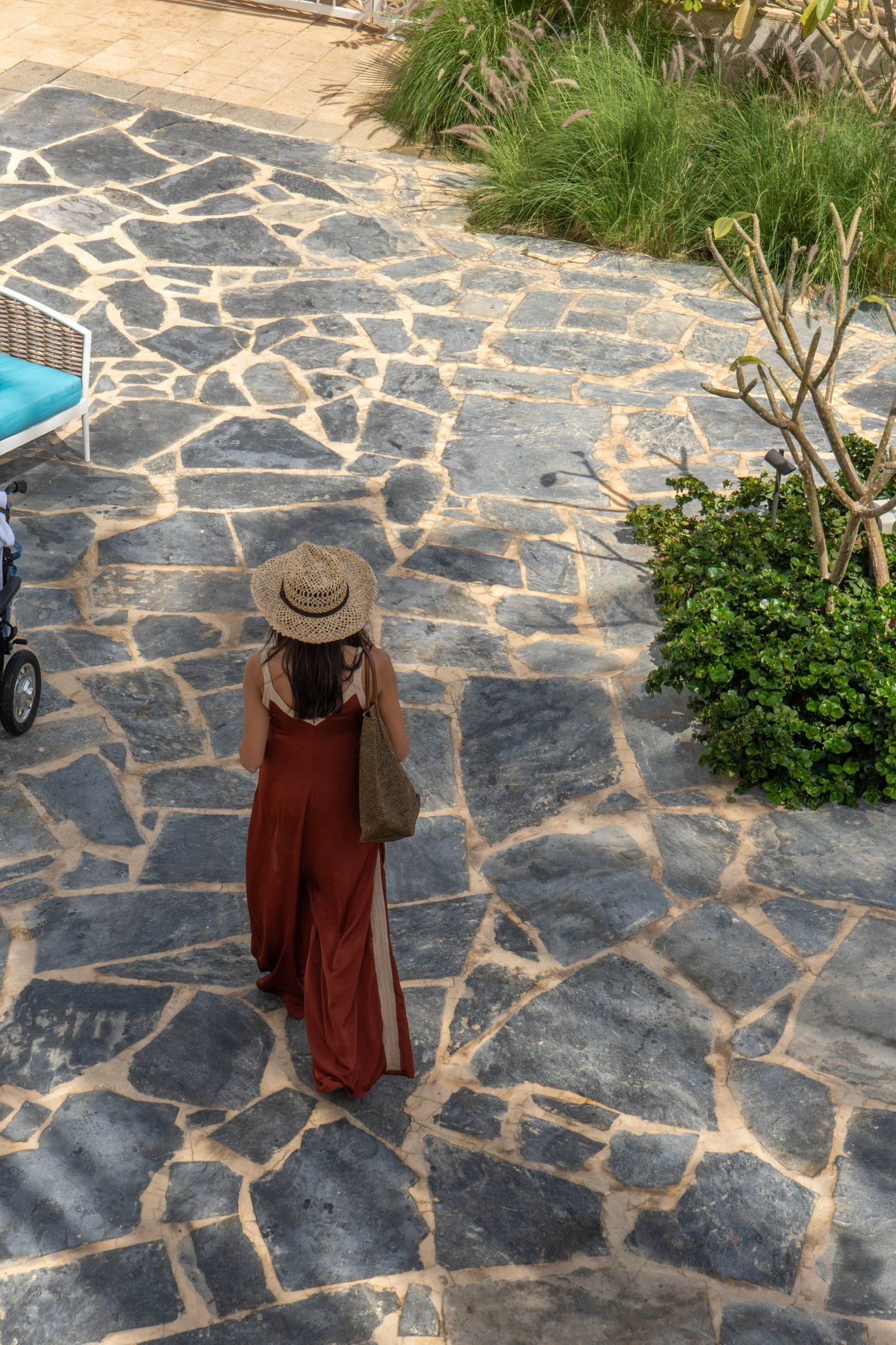 A guest on the stone path down to the water