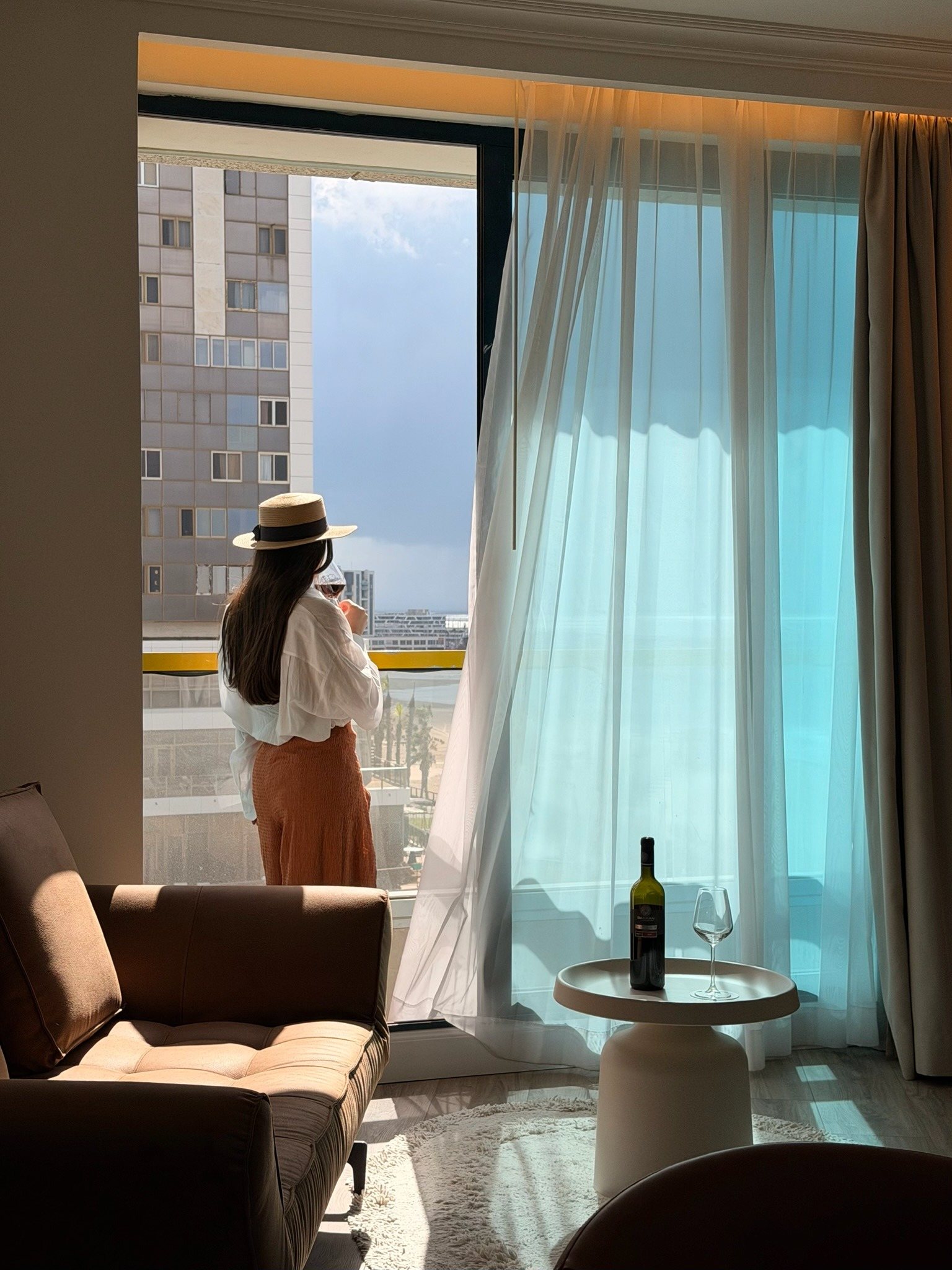 A glass poured by the window
