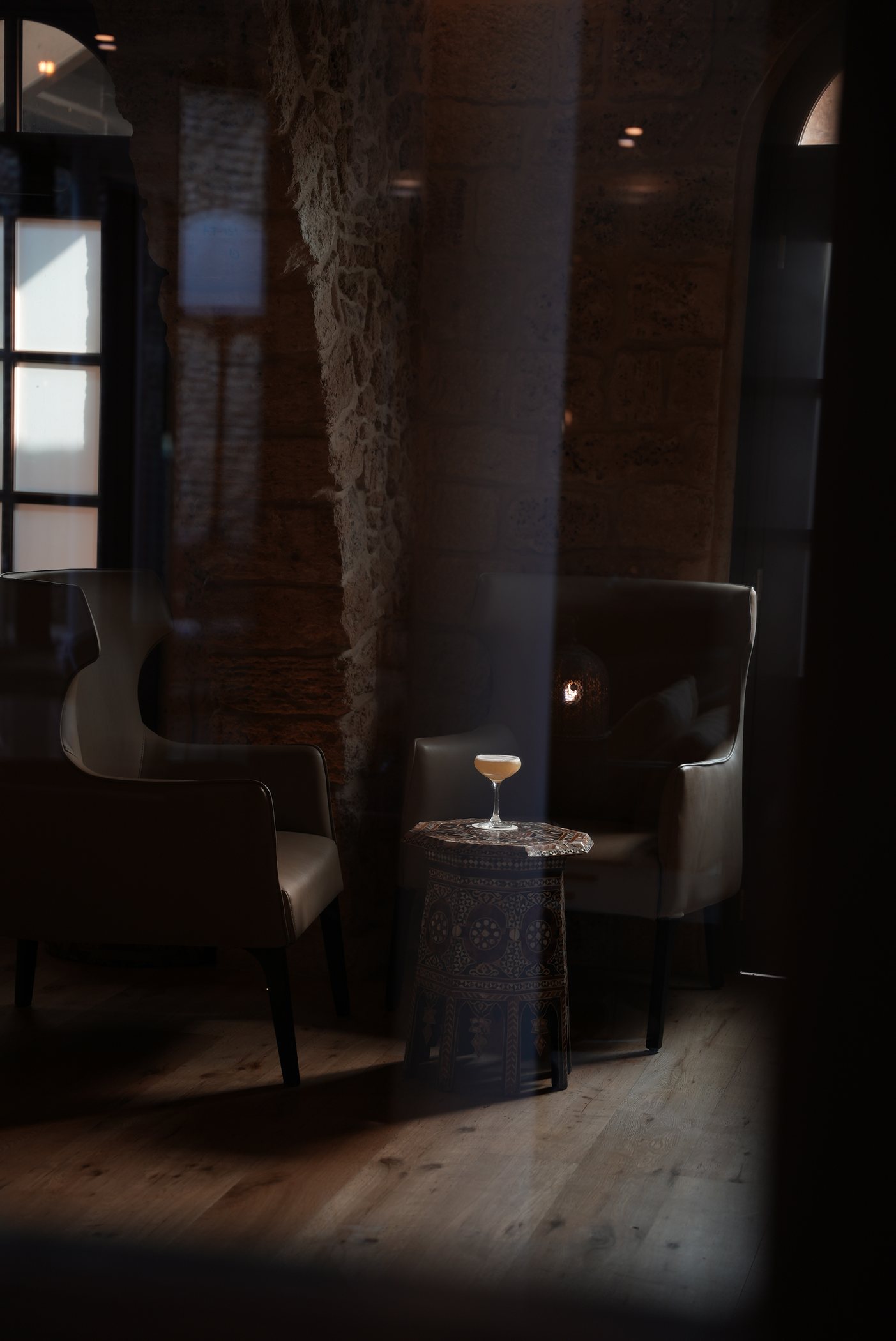 A corner of the bar, a cocktail on the table