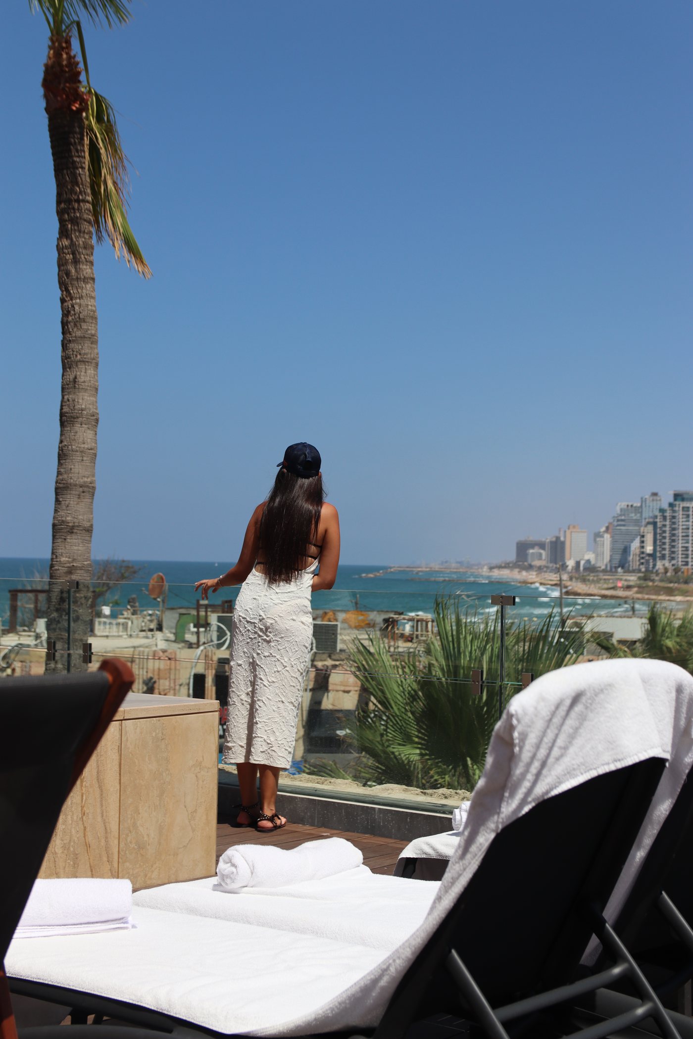 A guest on the deck, looking out to the sea