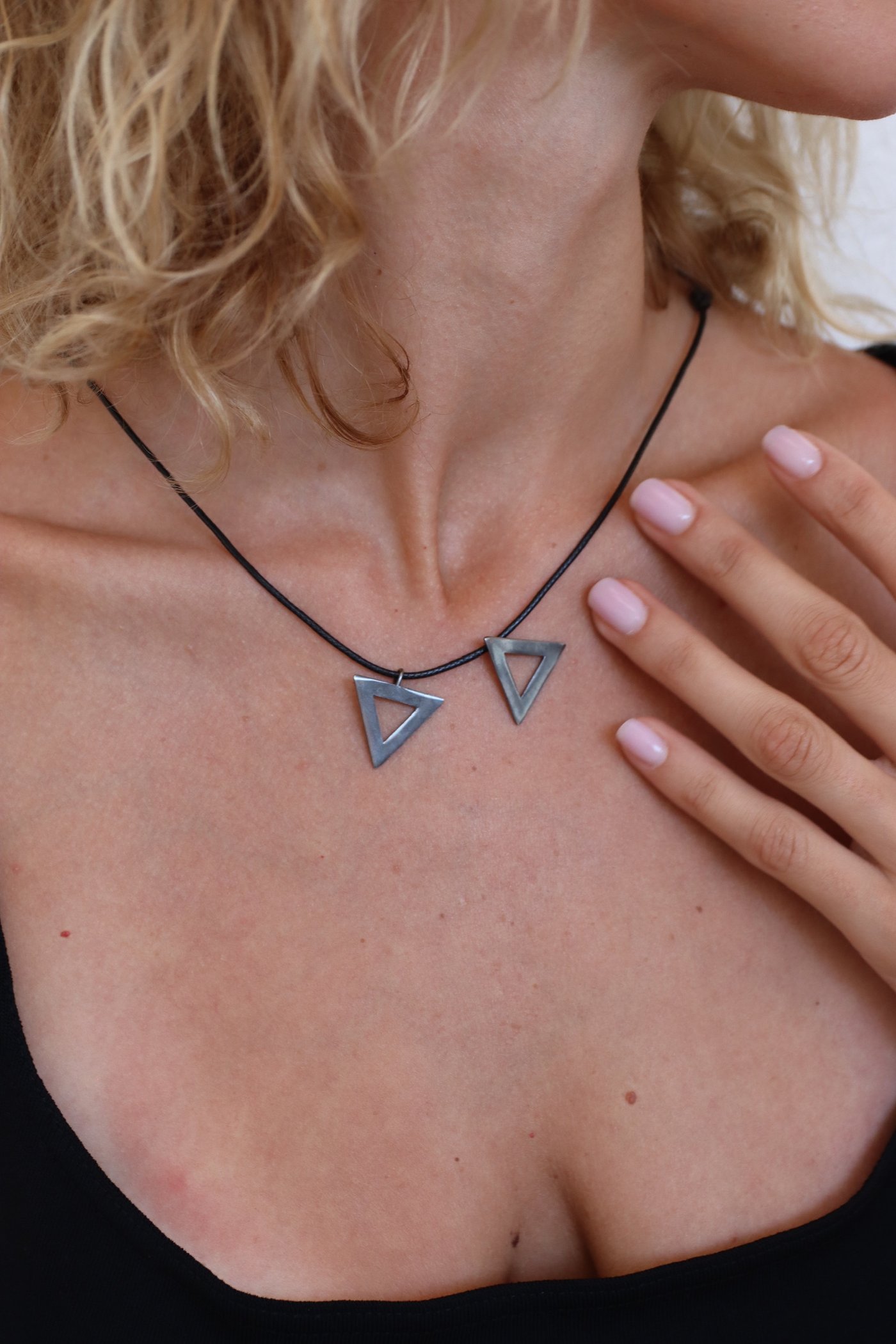 The two triangles worn together