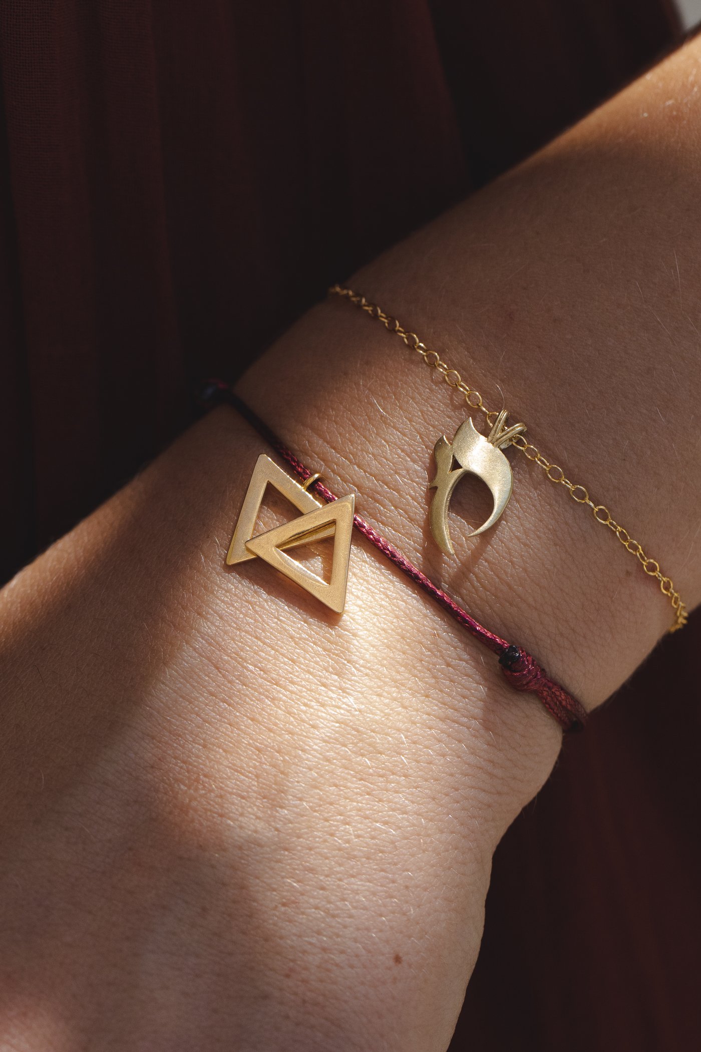 The charms along the wrist